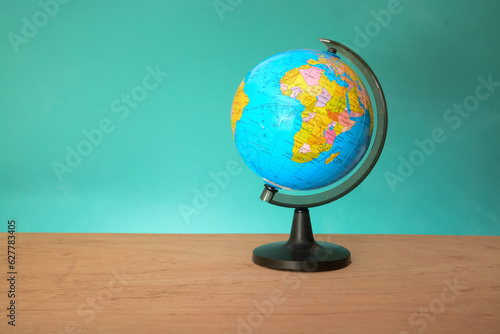 World globe isolated on a green background. Copy space.Earth day or environment conservation concept. Save green planet concept
