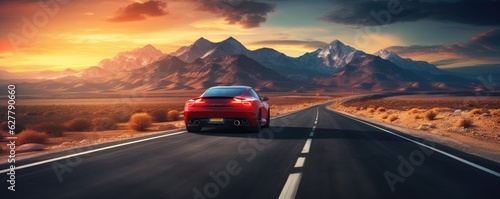 Fast sports car on road with shaped mountains in background, travel abroad concept, panorama.