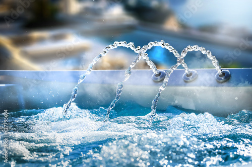 Hot tube water jet close up. Jacuzzi Pool with Fresh Blue Water photo