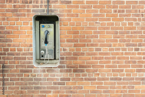 telephone booth on a brick wall background