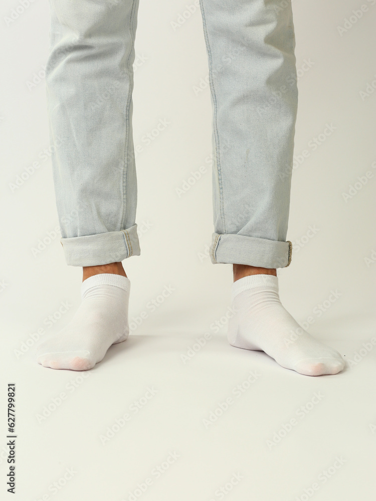 white sock with copy space on human foot closeup photo on white background