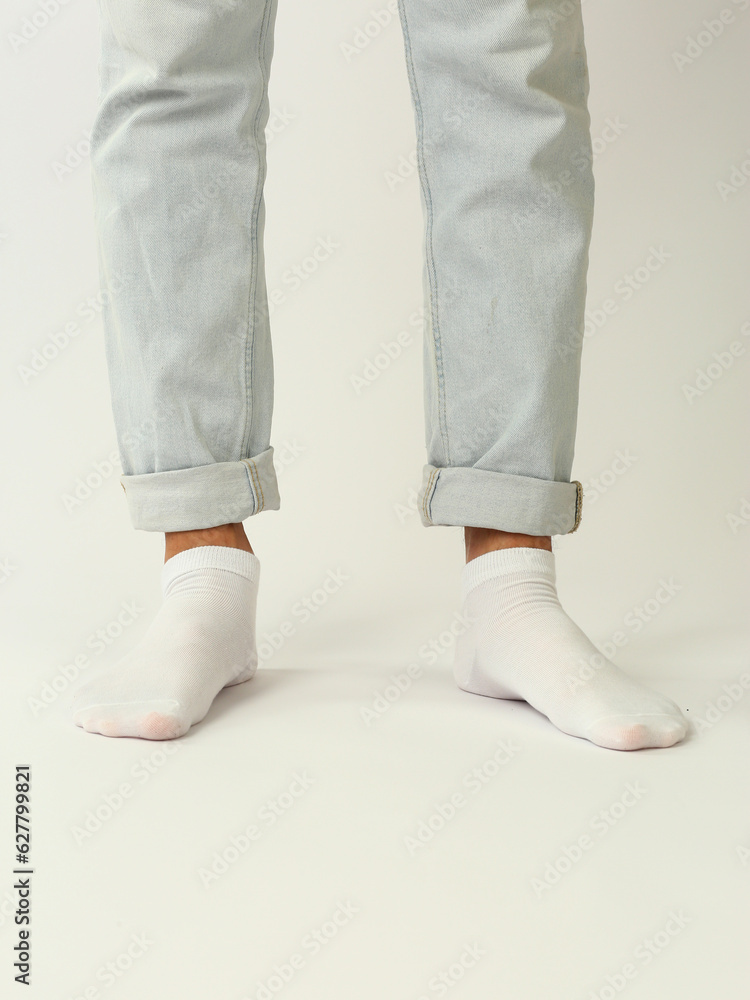 white sock with copy space on human foot closeup photo on white background white sock with copy space on human foot closeup photo on white background