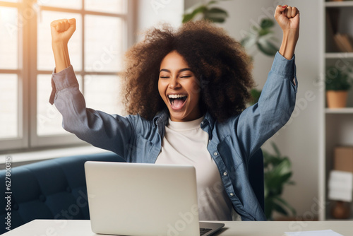 Fototapeta Excited happy african american woman feeling winner rejoicing online win got new