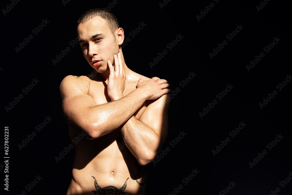 Young attractive guy is resting and posing at home.