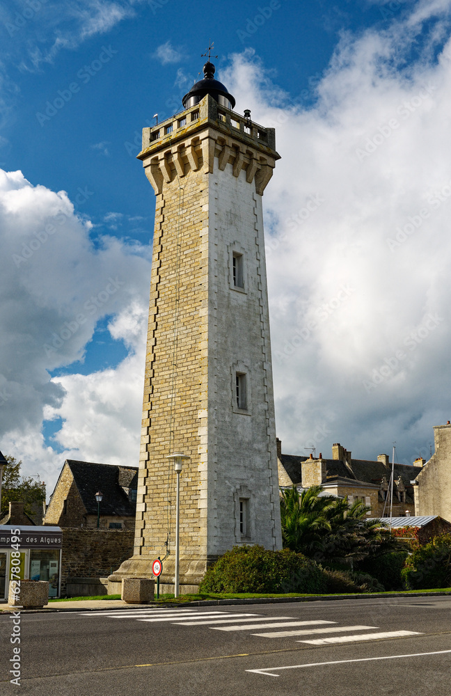 Roscoff Lighthouse, built 1915, overlooks the harbour of Roscoff. Finistere, Brittany, France
