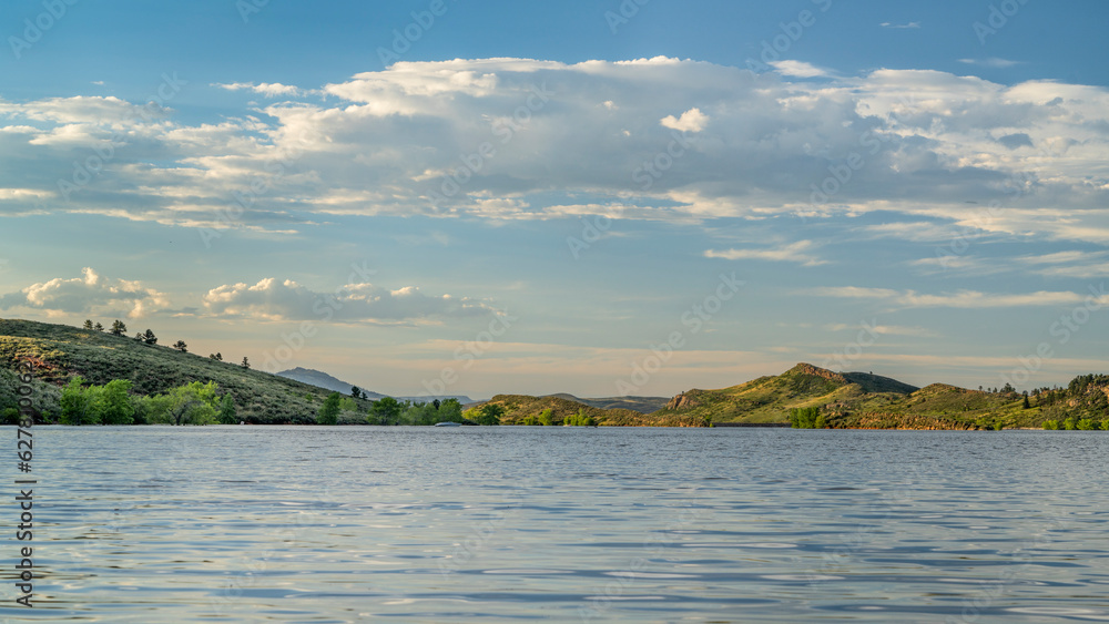 summer scenery of Horsetooth Reservoir in Colorado with some distant boats
