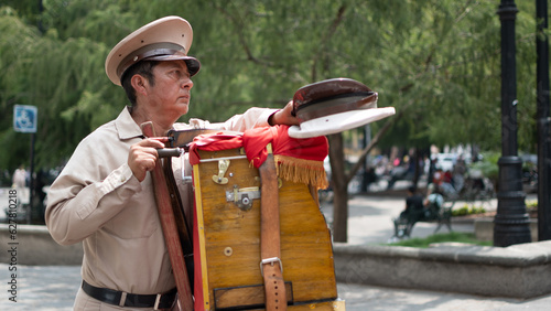 Man playing wooden organ in Mexico City photo