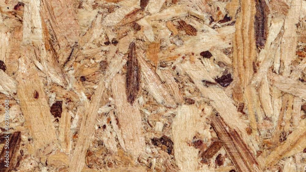 Chipboard, rough surface moving sideways, close-up macro, top view
Chipboard, rough surface moving sideways, close-up macro, top view