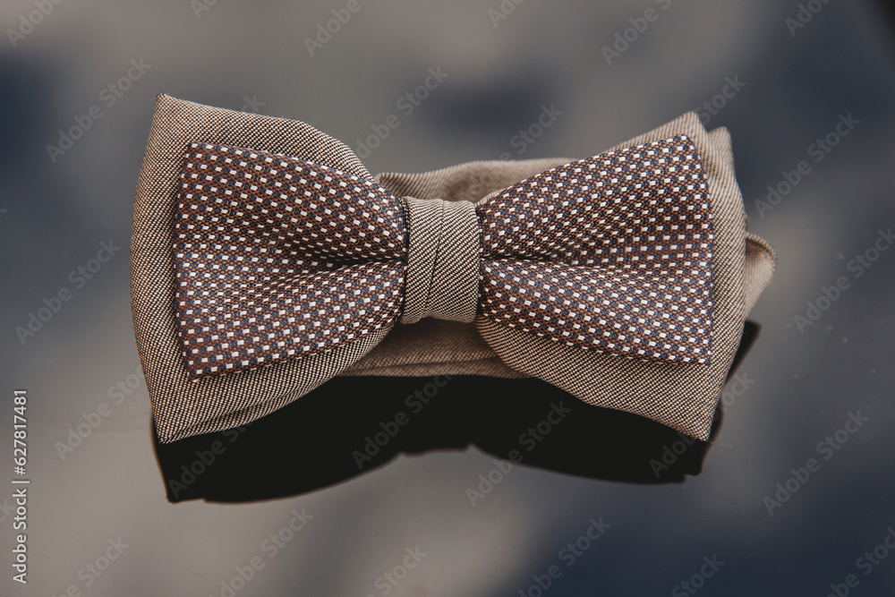 Men's bow tie on a mirror background. Close-up. Men's bow tie on a mirror background. Close-up.
