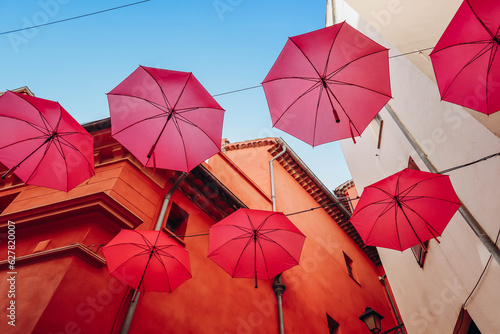 Famous pink umbrellas decorating the central streets of Grasse