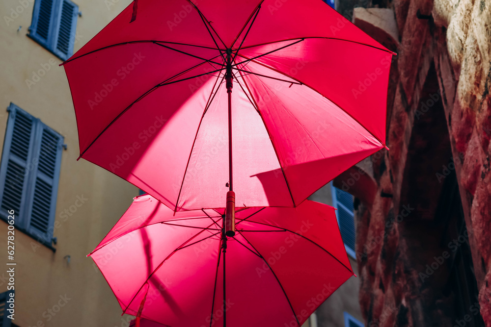 Famous pink umbrellas decorating the central streets of Grasse