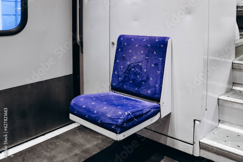 Nice, France - 23 July 2023: A small jump seat at the entrance, inside a SNСF train, type TER photo