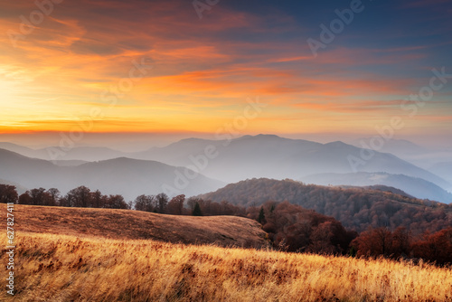 Autumn mountains with orange forest during sunset. Landscape photography © Ivan Kmit
