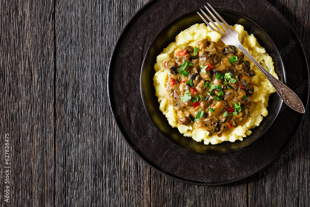 potato mash topped with mushroom gravy in bowl potato mash topped with mushroom gravy in bowl