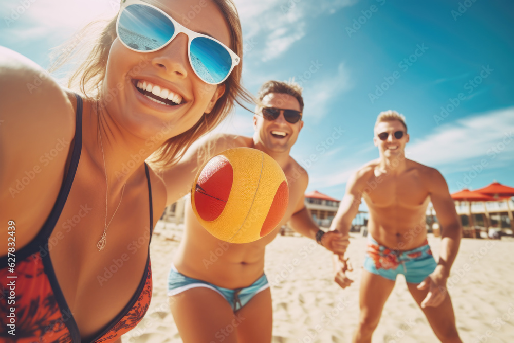 A group of young friends playing beach volleyball and having fun together on a summer holiday 