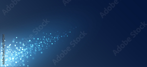Sparkling banner. Sparks and stars on gradient blue background. Blurred, bright and magical bohek effect.