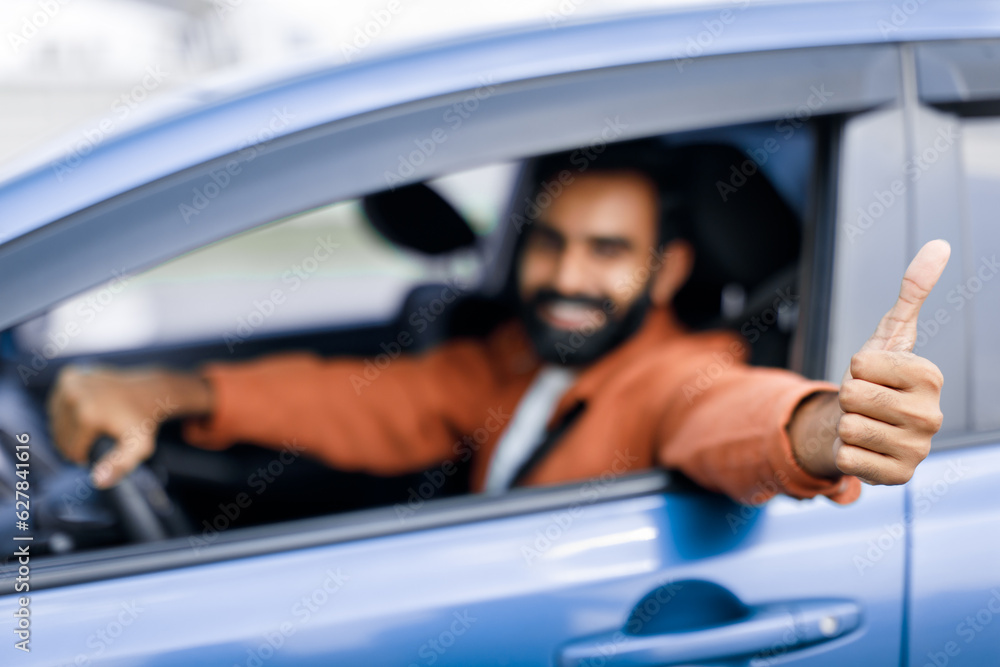 Happy Indian Man Driver Showing Thumbs Up In New Automobile
