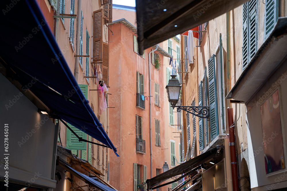 Narrow street with a lantern in the old town in Nice France