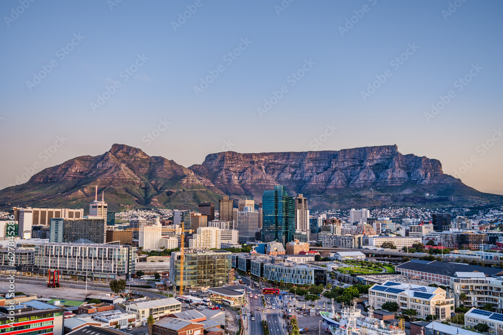 Fototapeta premium Wide angle shot of Cape Town city central business district and table mountain in the background during sunset, South Africa