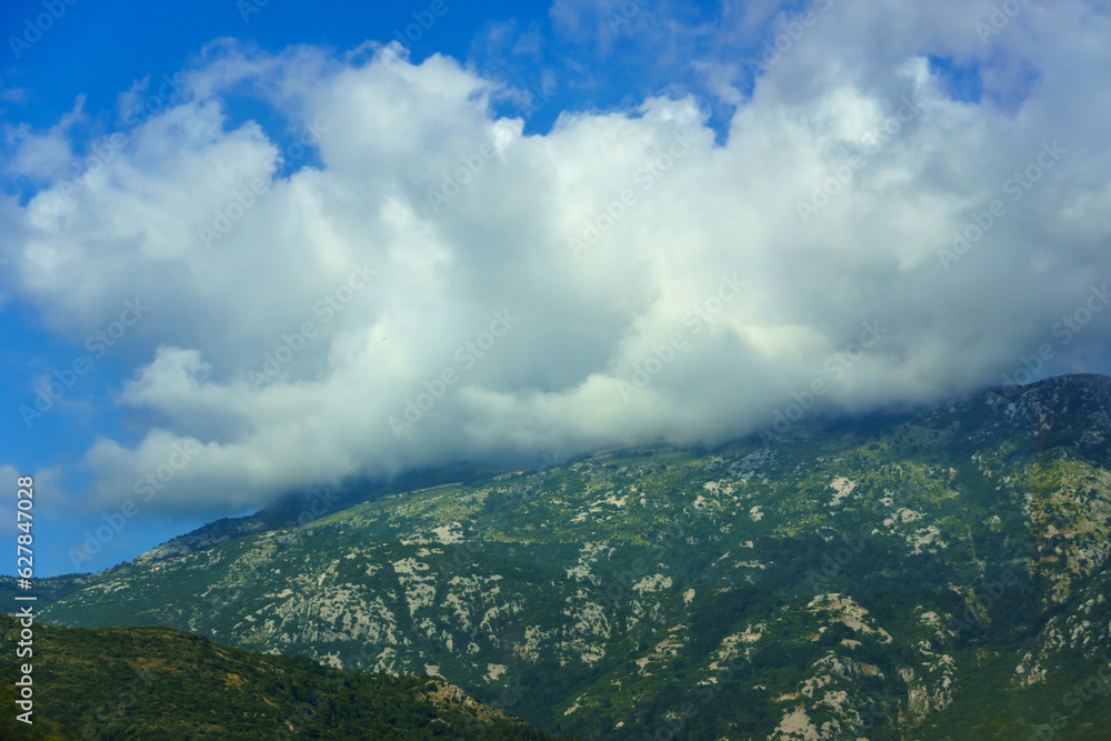 beautiful mountains and cloudy sky, summer landscape, clouds, forest on the hillsides