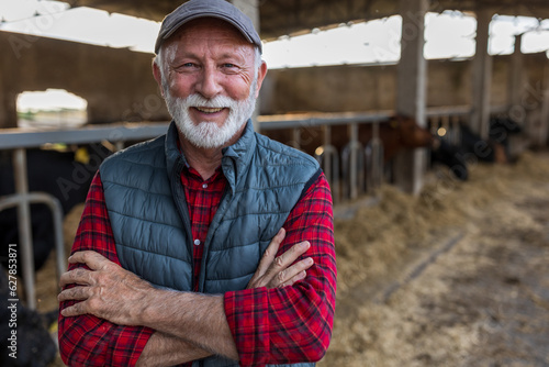 Fényképezés Farmer standing in front of cattle ranch