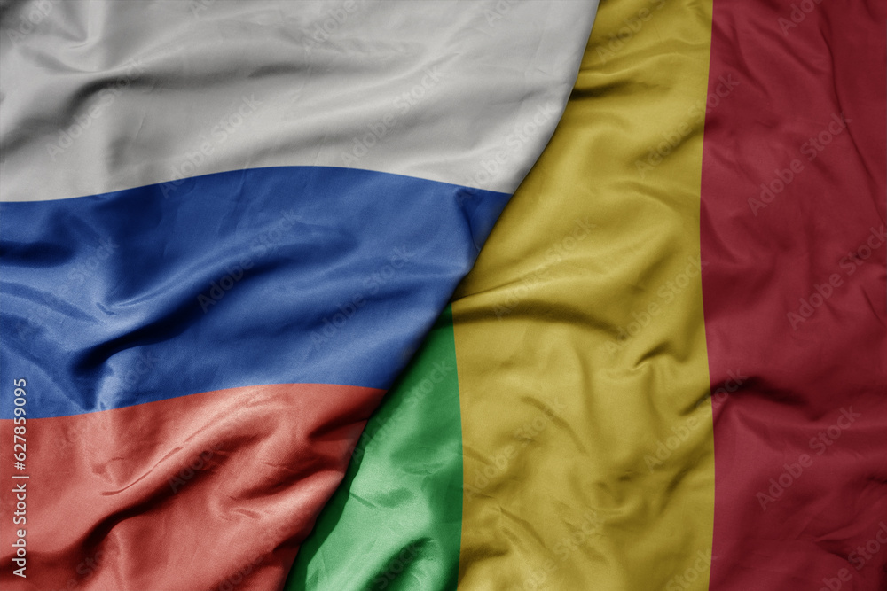 big waving realistic national colorful flag of russia and national flag of mali .