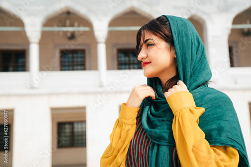 Canvas Print Portrait of smiling muslim woman outdoors