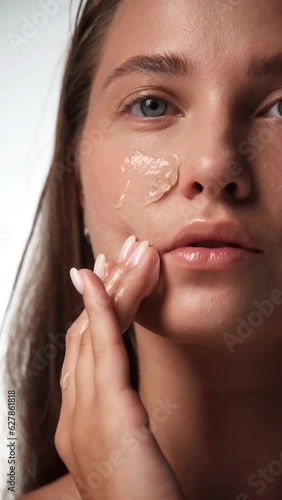 Beautiful young woman with a light natural make-up and perfect skin.