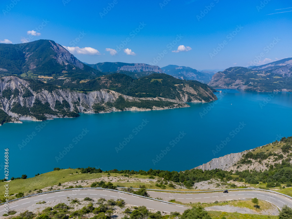Fototapeta premium Aerial view on blue Lake of Serre-Poncon, reservoir&nbsp;border between&nbsp;Hautes-Alpes&nbsp;and&nbsp;Alpes-de-Haute Provence&nbsp; departments, one of largest in&nbsp;Western Europe
