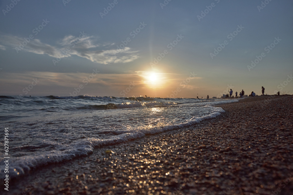 Orange-gold sunset, sky, sunlight, summer mood landscape with sea sunset on beach.