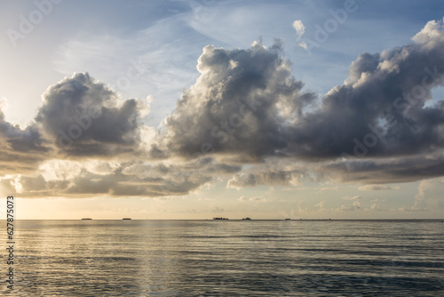 background of smooth waves at the sea with cloudscape