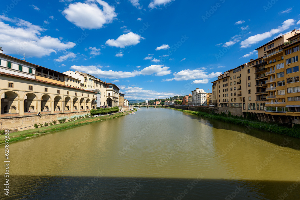 Naklejka premium Florence, Italy - June 28, 2023: Florence, Italy on the Arno River. View of Ponte Vecchio bridge.