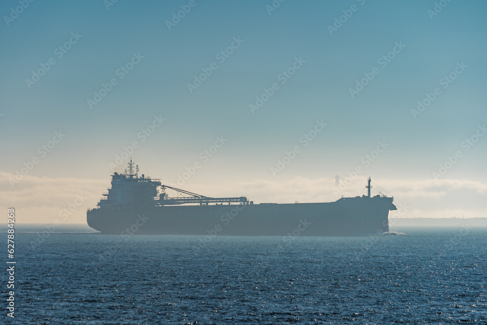 Large oil tanker departing San Francisco Bay in morning