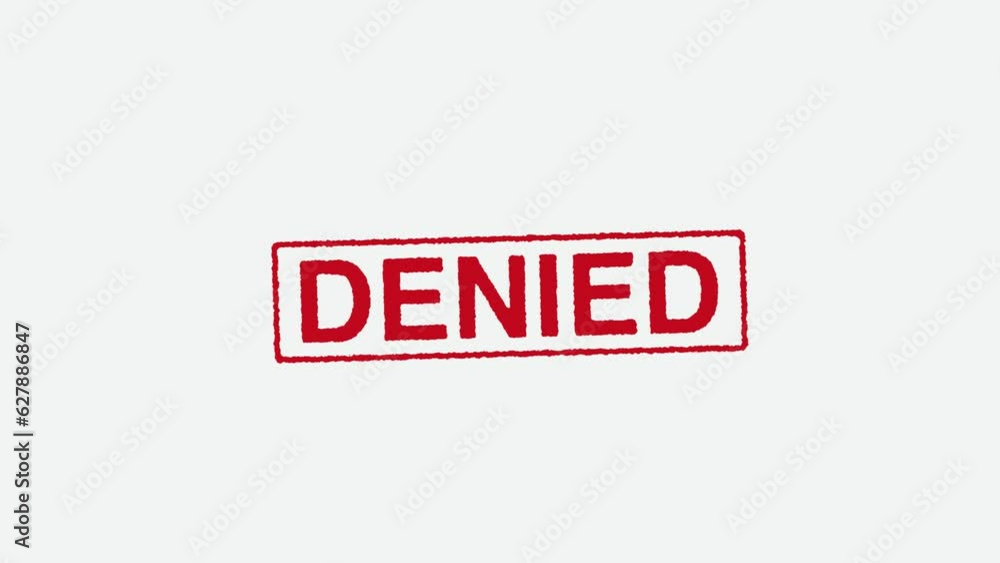 Close Up Real Hand Stamping Denied Stamp on White Background Close Up Real Hand Stamping Denied Stamp on White Background