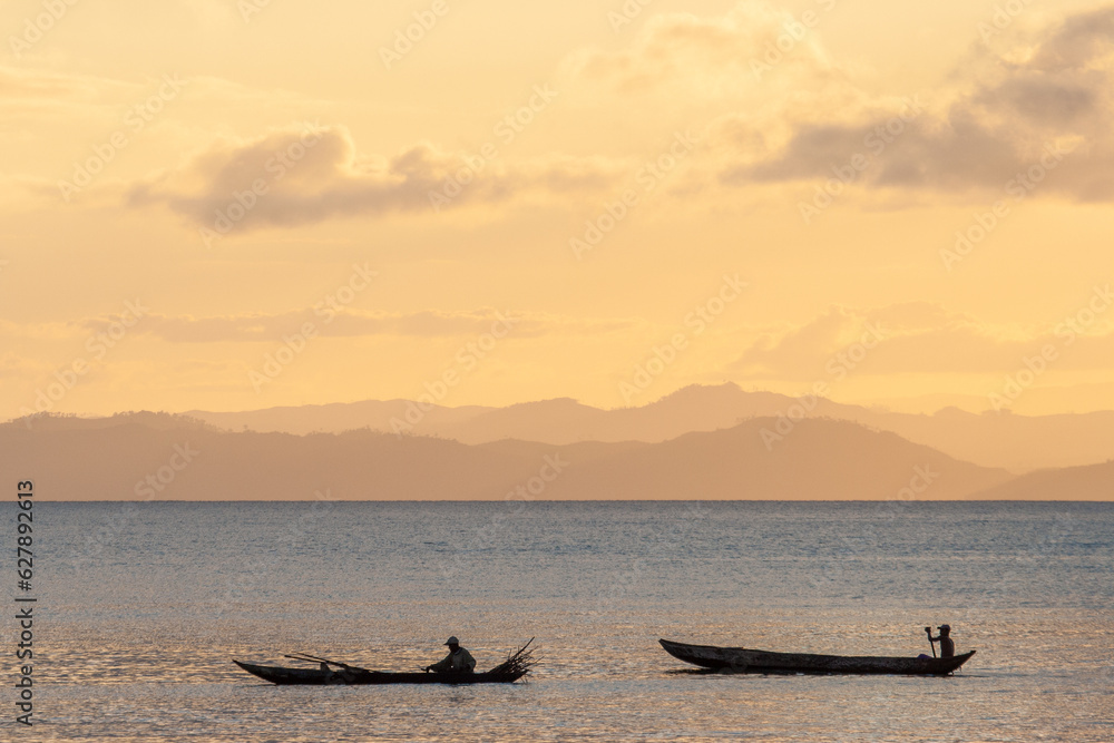Fisherman in Pirogue at Nosy Boraha, also known as Sainte-Marie island, east coast of Madagascar. Sunset Fisherman in Pirogue at Nosy Boraha, also known as Sainte-Marie island, east coast of Madagascar. Sunset