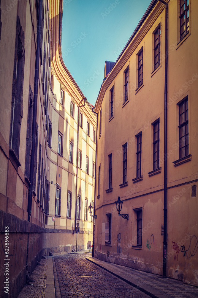 Vintage retro hipster style travel image of Prague street with old houses, Prague, Czech Republic