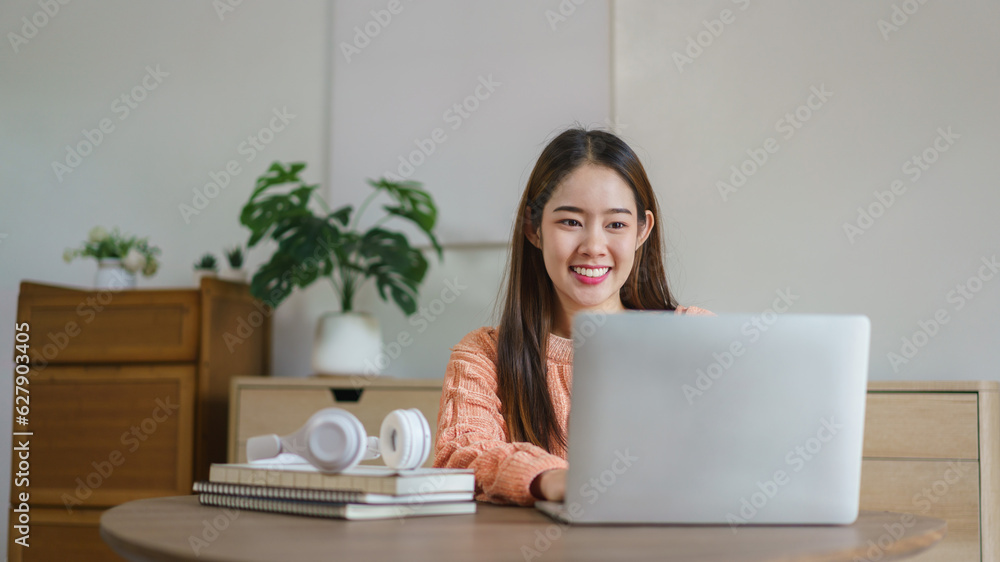 Women sitting on the floor and working to typing business data on laptop in lifestyle at home Women sitting on the floor and working to typing business data on laptop in lifestyle at home