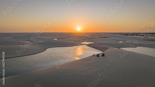 sunset on the beach, dunes and ponds, beach and sky photo