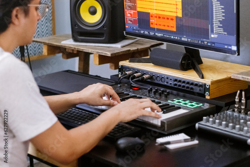 hands on board playing piano roll. Music Production, Home Studio Recording