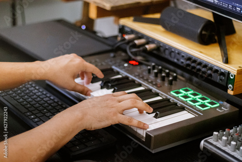 hands on board playing piano roll. Music Production, Home Studio Recording