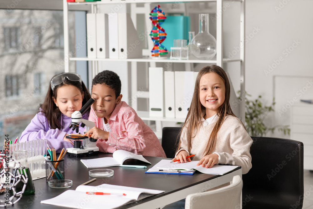 Little children with molecules studying Chemistry in science classroom Little children with molecules studying Chemistry in science classroom