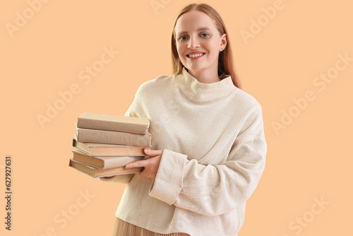 Young woman with books on b...