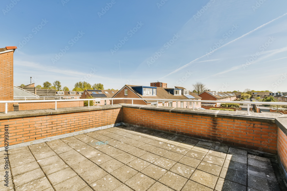 a roof with some bricks and blue sky in the background, taken from an angle on a clear sunny day