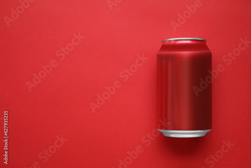 Can of soda on red background