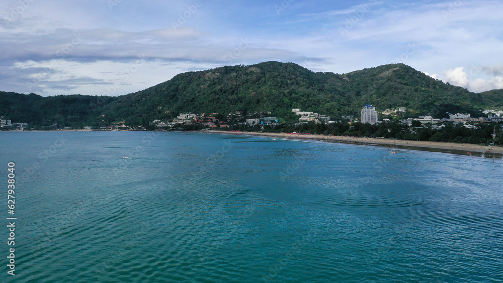 Aerial view of sea front hotels and apartments and the hill behind the buildings in Patong beach, Phuket island, Thailand.