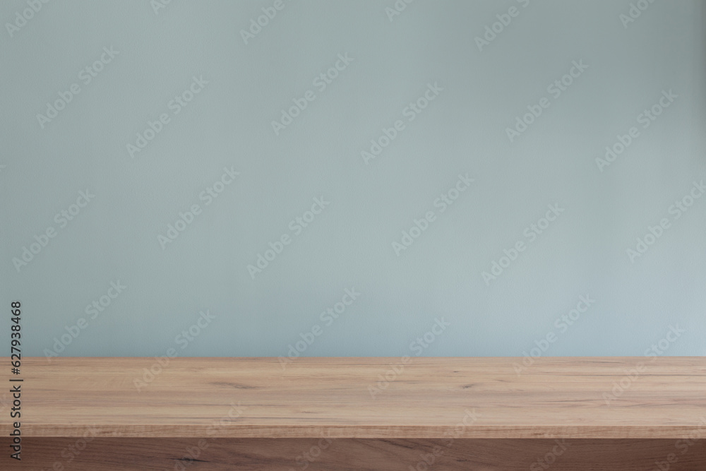 background with modern wooden table and blue wall background with modern wooden table and blue wall