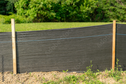 Silt Fence fabric with wooden posts installed prior to the start of construction Fototapet