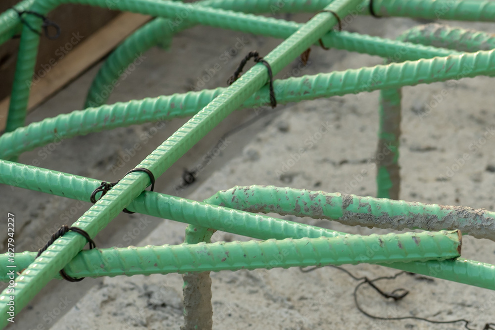 Epoxy coated rebar is used in concrete subjected to corrosive conditions.  These may include exposure to deicing salts or marine environments.