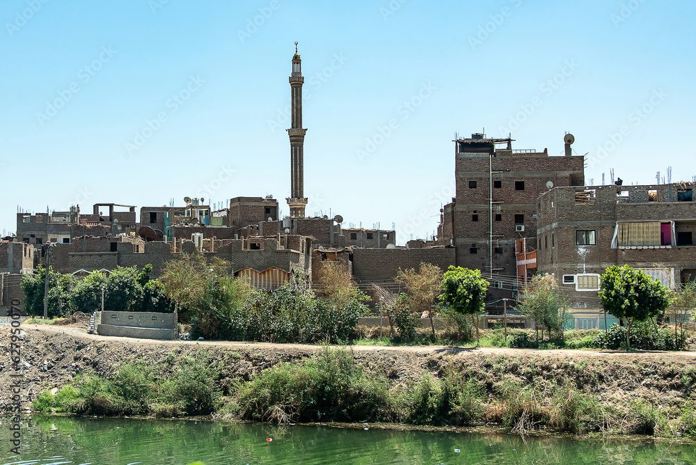 View across rural egypt near river Nile in Egypt rural countryside landscape with african houses
