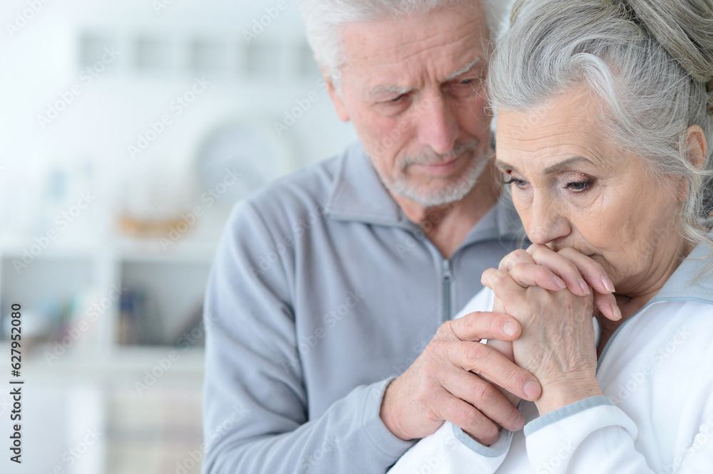 Close up portrait of sad senior couple isolated on white background Close up portrait of sad senior couple isolated on white background